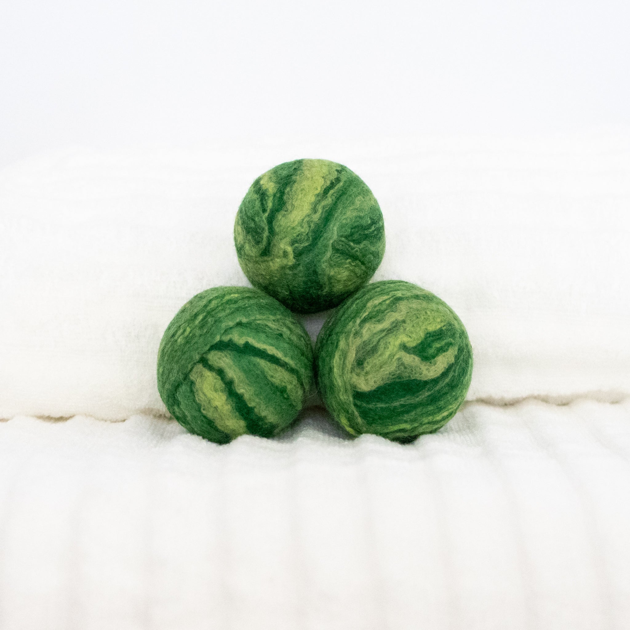 green wool dryer balls